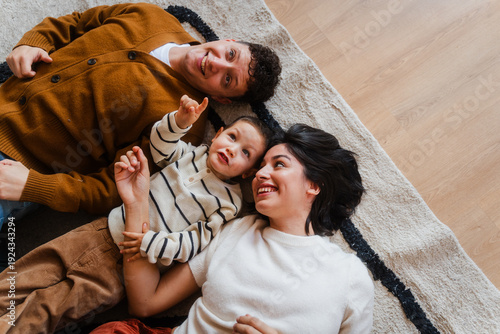 Happy family lies on the floor