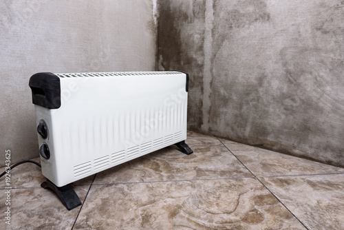 Cuadro en lienzo Modern portable electric heater, heating the basement