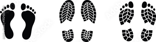 A set of black footprints from different creatures on a white background for reference