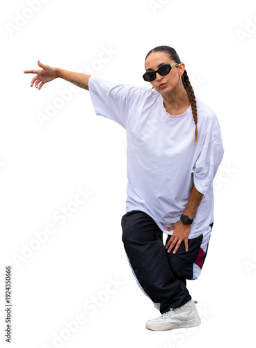 Photography Young woman in relaxed streetwear pointing with hand, performing hip hop dance