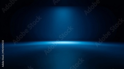 Dramatic blue spotlight on dark empty stage