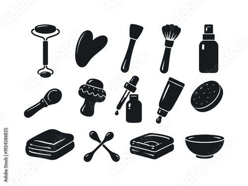 Solid vector icons of facial care tools: facial roller, gua sha stone, spatula, brush, spray bottle, massage tool, dropper,