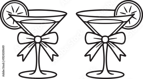 Two elegant martini glasses each garnished with a fresh lemon slice and a decorative bow ready for a celebration