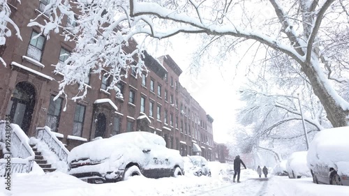 couple dig out their car during a snow storm in Brooklyn