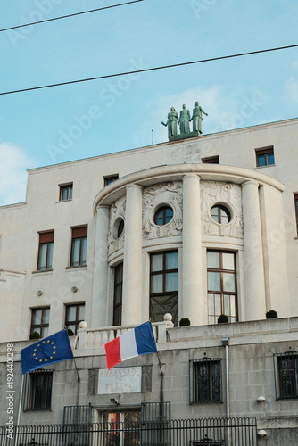 French Embassy building in Belgrade with neoclassical columns and European Union and France flags, representing diplomacy, international relations and official government presence.