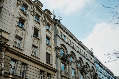 Historic urban facade with decorative elements and balconies creating architectural perspective in Belgrade.