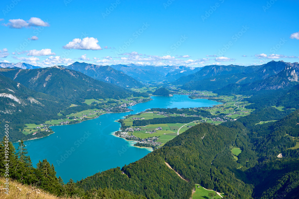 Fototapeta premium Breathtaking panorama of Lake Wolfgang facing Strobl, taken from the summit of Mount Zwölferhorn in the Salzkammergut region, Austria.