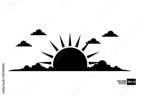 Sunrise silhouette with clouds and sun rays emerging from behind the horizon