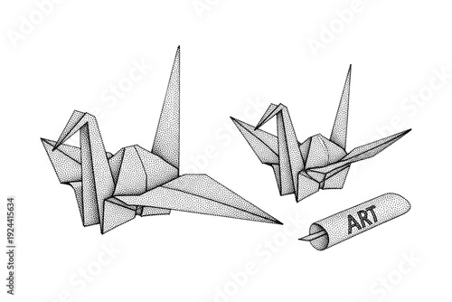 Two delicate origami paper cranes and a rolled paper scroll with the word ART