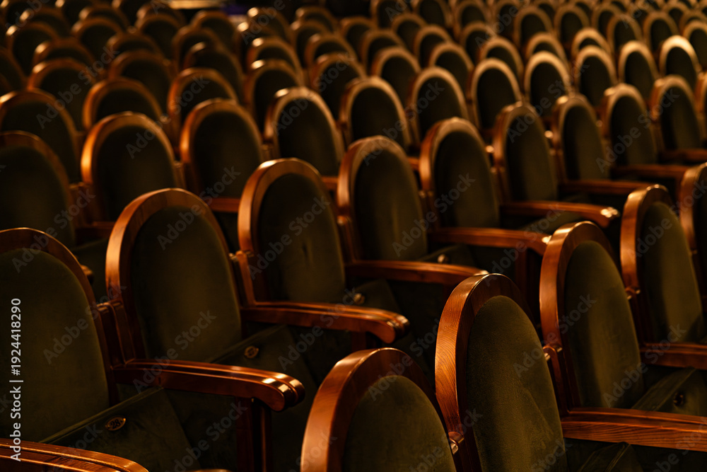 Fototapeta premium Empty Classic Theater Auditorium with Rows of Velvet Seats and Wooden Armrests