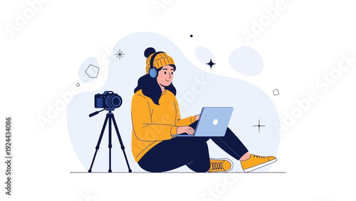 Young woman using laptop and headphones, camera on tripod, online content creation