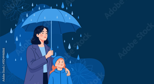 Mother and child standing together under umbrella in rainy weather.