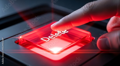 Deleting Data - A Close-Up of a Red Delete Button Being Pressed.