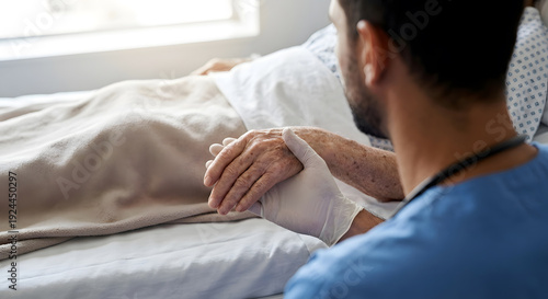 Nurse comforts senior patient at bedside