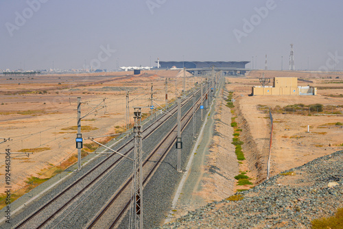 High-speed railway tracks of the Haramain High-Speed Railway stretching through the Saudi Arabian desert towards KAEC