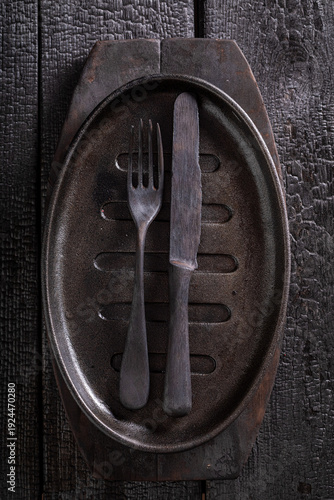 Empty black metal grill pla...