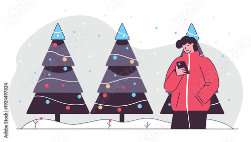 Person in a red jacket looking at a phone while standing near festive Christmas trees covered in snow.
