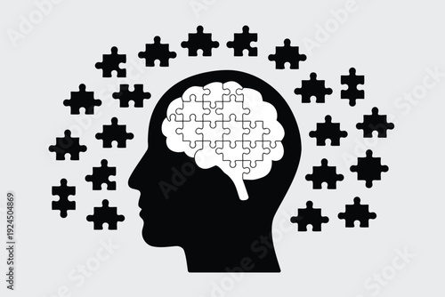 The puzzle pieces forming a human brain silhouette symbolizing cognitive processes and learning.