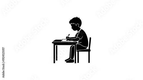 Silhouette of a young boy diligently writing at a desk focused on his studies.