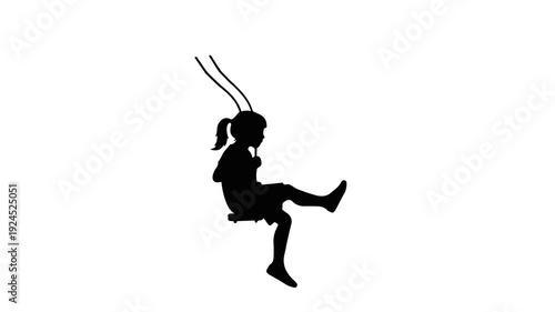 Silhouette of a young girl swinging joyfully on a swing set.