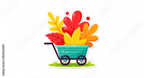 Colorful wheelbarrow overflowing with vibrant red orange and yellow autumn leaves on green grass