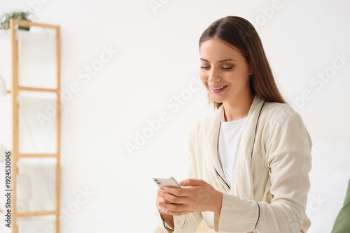Young woman using mobile ph...