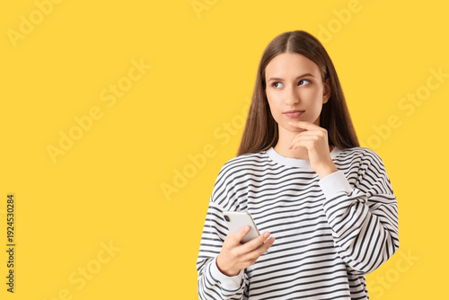 Thoughtful young woman with...