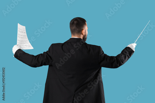 Young male conductor on blu...
