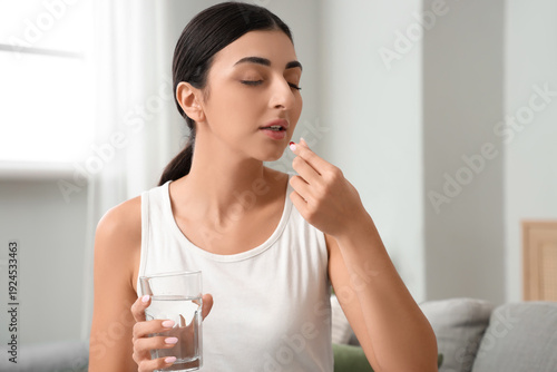 Young woman with glass of w...