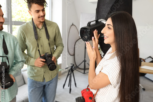 Female photographer with li...