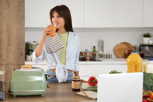 Young woman with toaster dr...