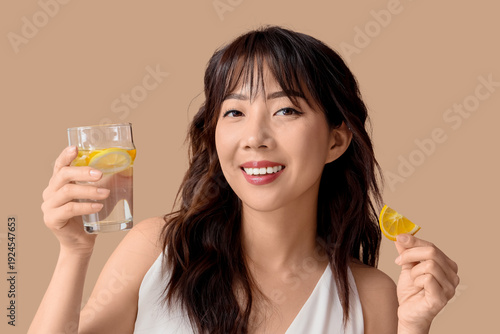 Young Asian woman with citr...