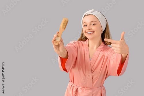 Young woman pointing at mas...
