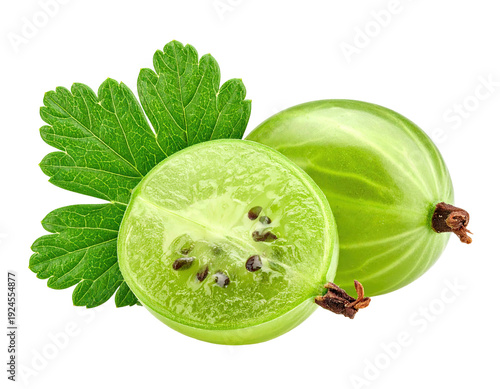 Two green fruit, one sliced, with leaves on a black background