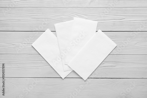 Paper napkins on white wood...