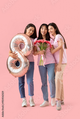 Young women with balloon in...