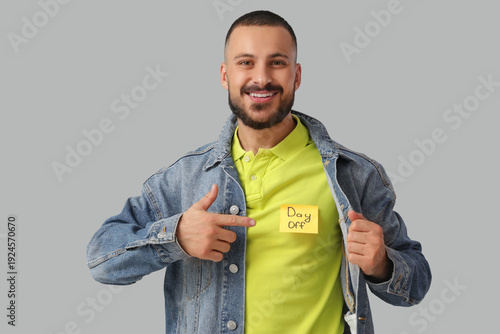 Young man pointing at stick...