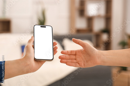 Women with blank mobile pho...