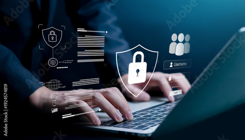 Photos Business professional typing on laptop with cybersecurity lock icons and login interface