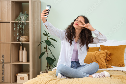 Teenage girl with mobile ph...