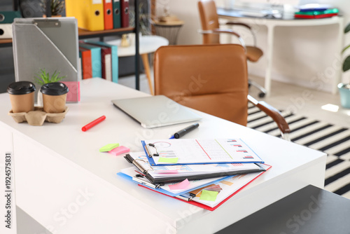 Clipboards on desk in moder...