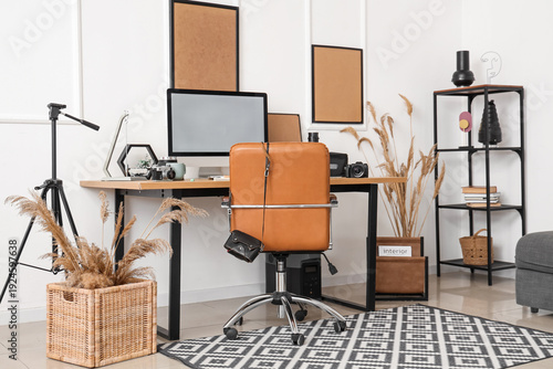 Stylish workplace with mode...