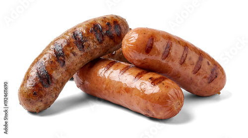 Quadro su tela a close-up photograph of four grilled sausages with prominent grill marks, artistically arranged on a white surface