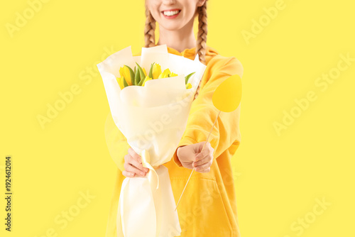 Young girl with flowers and...