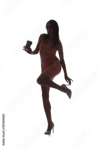 Silhouette of young woman w...