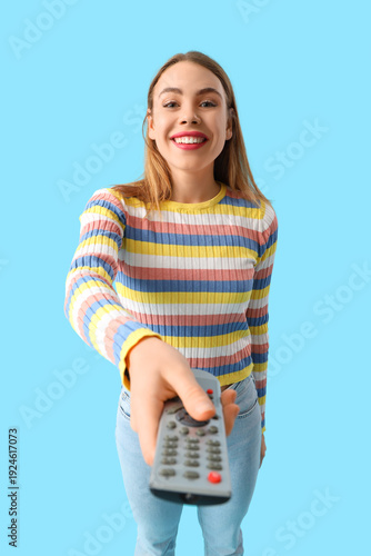 Happy young woman with remo...