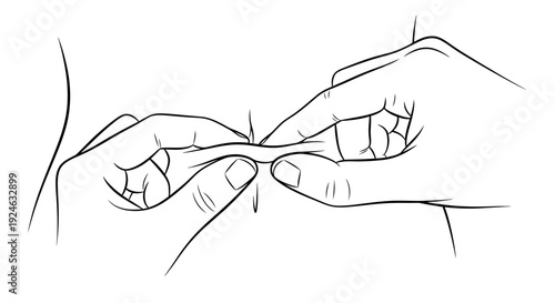 Close-up of hands rolling a cigarette, preparing tobacco for smoking.