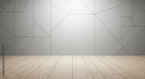 A minimalist room with a wooden floor and a white wall with geometric patterns.