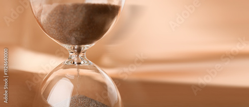 Crystal hourglass on beige ...