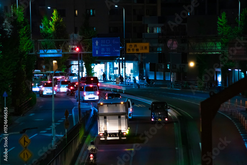 A night cityscape of traffic jam at the downtown street in Tokyo telephoto shot